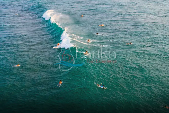 Aerial view of surfers near Hikkaduwa beach. Hikkaduwa, Sri Lanka.